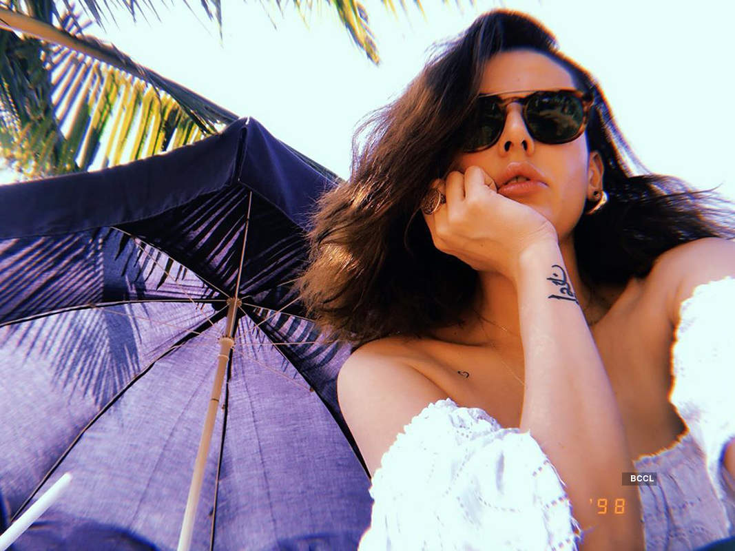 Bikini-clad Mandana Karimi is turning up the heat with her pool pictures