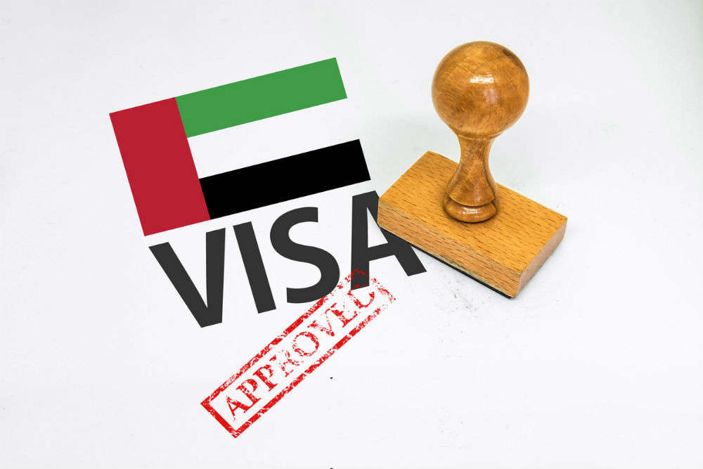 2. How can you complete this process to change your visa status in the UAE?