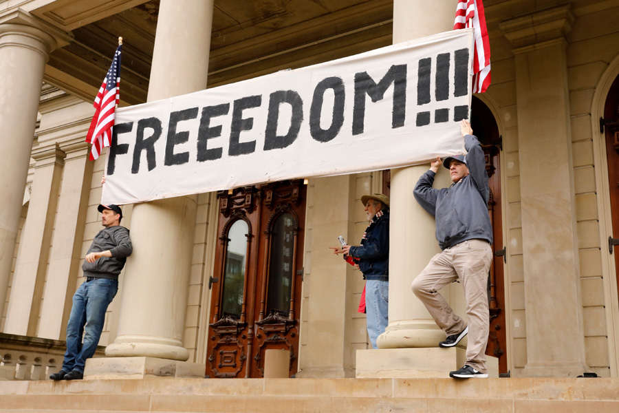 In pics: Armed protesters storm Michigan State House against COVID-19 lockdown