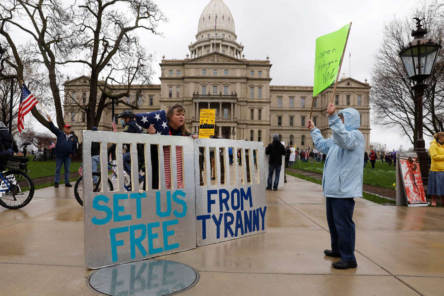 In pics: Armed protesters storm Michigan State House against COVID-19 lockdown