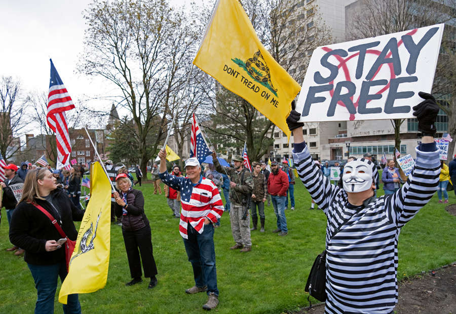 In pics: Armed protesters storm Michigan State House against COVID-19 lockdown