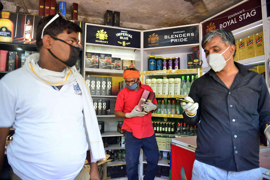 In pics: Long queues outside liquor shops as govt relaxes lockdown