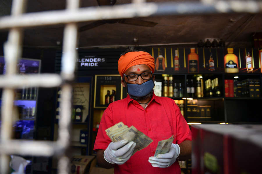 In pics: Long queues outside liquor shops as govt relaxes lockdown