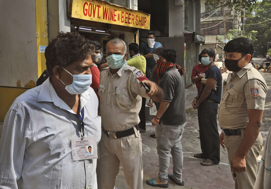 In pics: Long queues outside liquor shops as govt relaxes lockdown