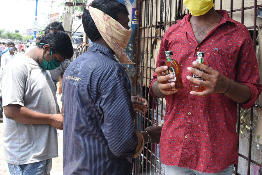 In pics: Long queues outside liquor shops as govt relaxes lockdown