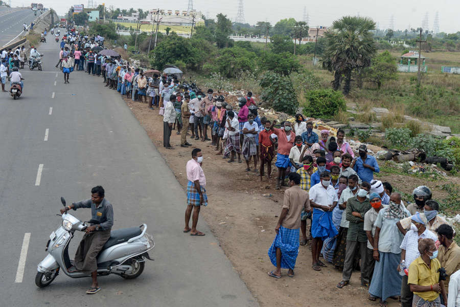 In pics: Long queues outside liquor shops as govt relaxes lockdown