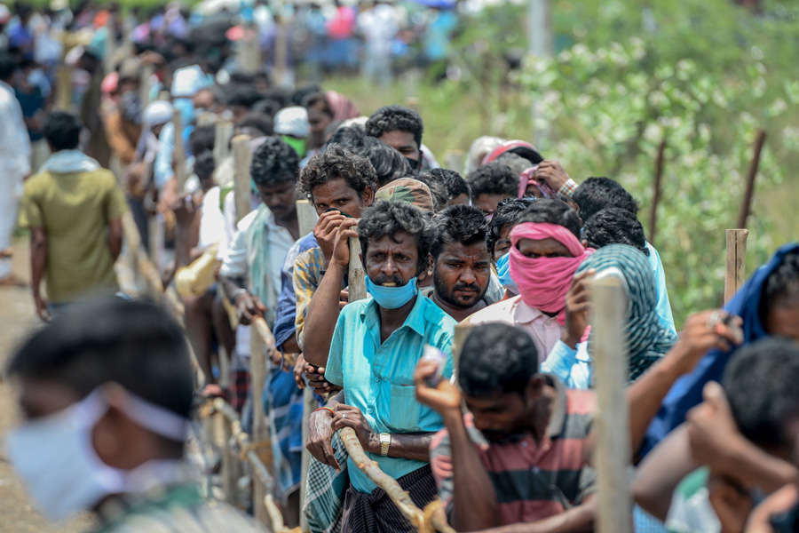 In pics: Long queues outside liquor shops as govt relaxes lockdown