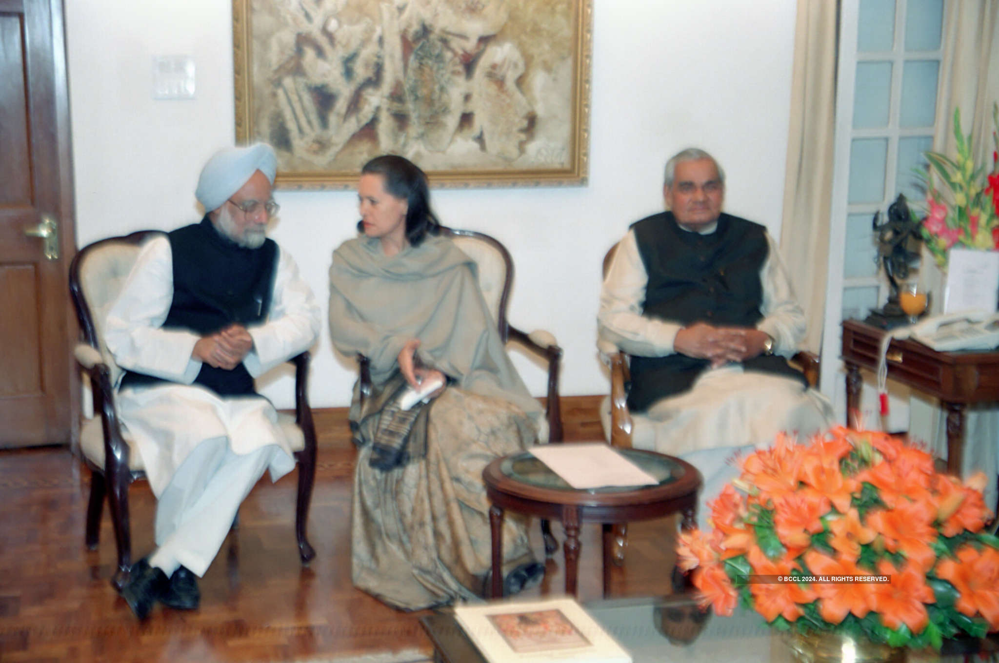 Congress president Sonia Gandhi, senior Congress leader Dr Manmohan Singh  (left) with Prime minister Atal Bihari Vajpayee at the latter's residence  in New Delhi on November 28, 1999 - Photogallery