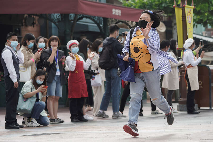 In pics: Shanghai Disneyland reopens with precautions