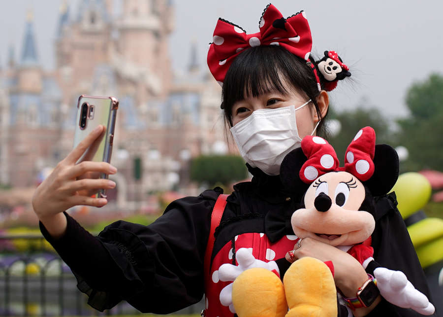 In pics: Shanghai Disneyland reopens with precautions