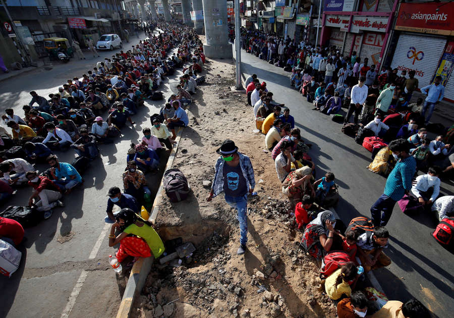 In pics: Stranded migrant workers desperate to return home
