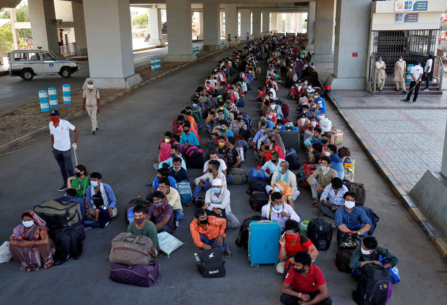 In pics: Stranded migrant workers desperate to return home