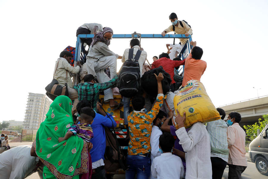 In pics: Stranded migrant workers desperate to return home