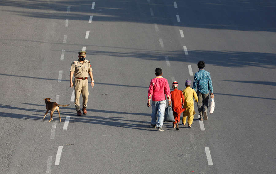 In pics: Stranded migrant workers desperate to return home