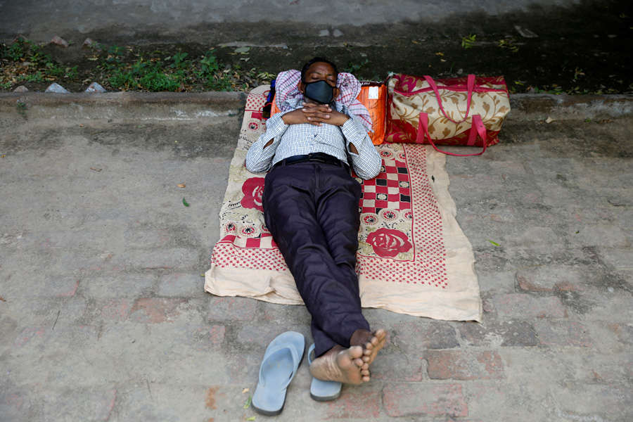 In pics: Stranded migrant workers desperate to return home