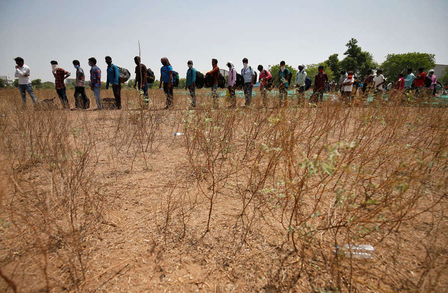 In pics: Stranded migrant workers desperate to return home