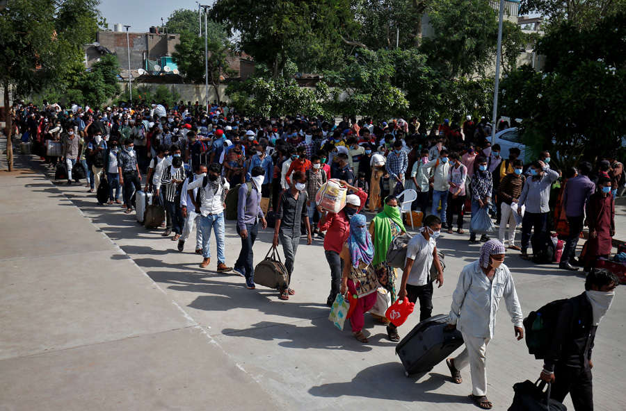 In pics: Stranded migrant workers desperate to return home