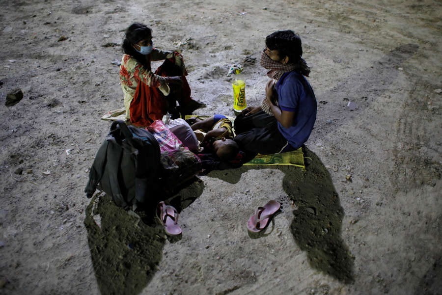 In pics: Stranded migrant workers desperate to return home