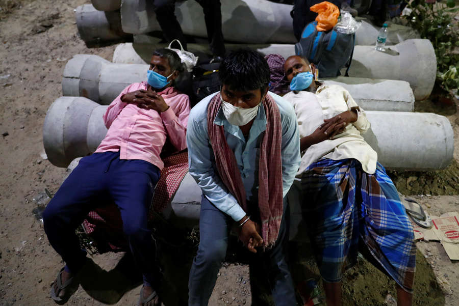 In pics: Stranded migrant workers desperate to return home