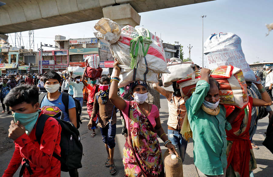 In pics: Stranded migrant workers desperate to return home