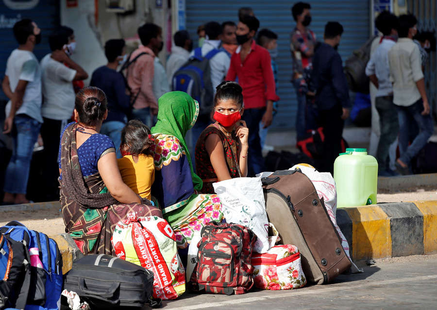 In pics: Stranded migrant workers desperate to return home