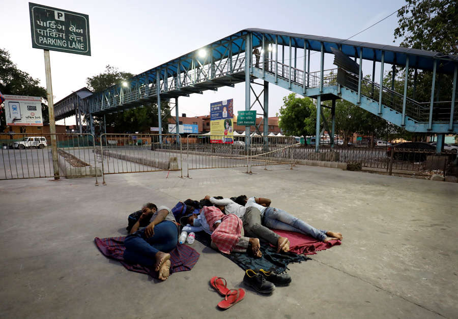 In pics: Stranded migrant workers desperate to return home