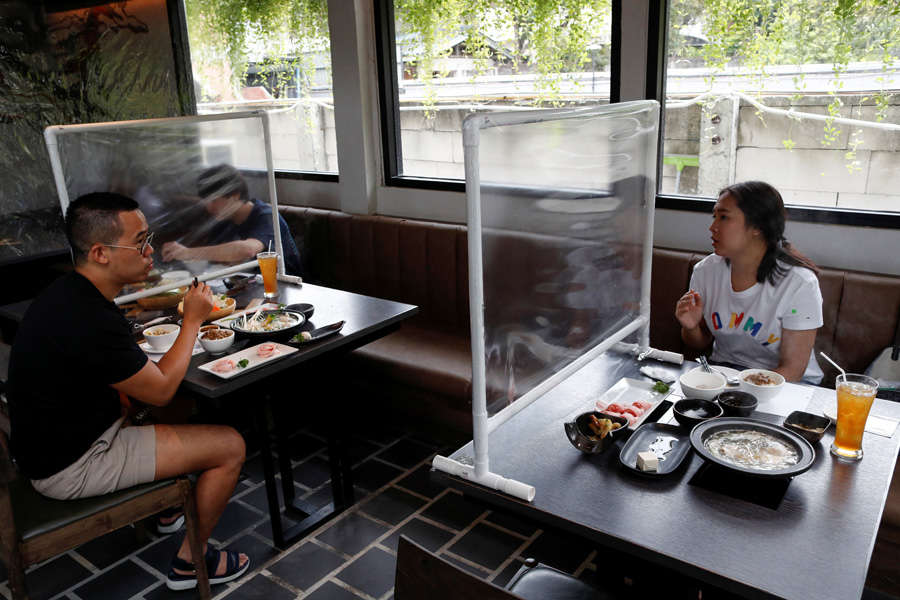 In pics: Restaurants reopen with social distancing amid coronavirus pandemic