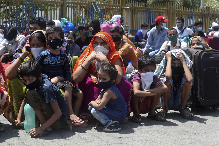 In pics: Stranded migrant workers desperate to return home