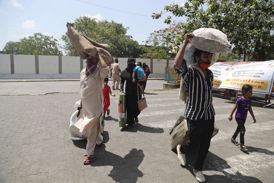 In pics: Stranded migrant workers desperate to return home