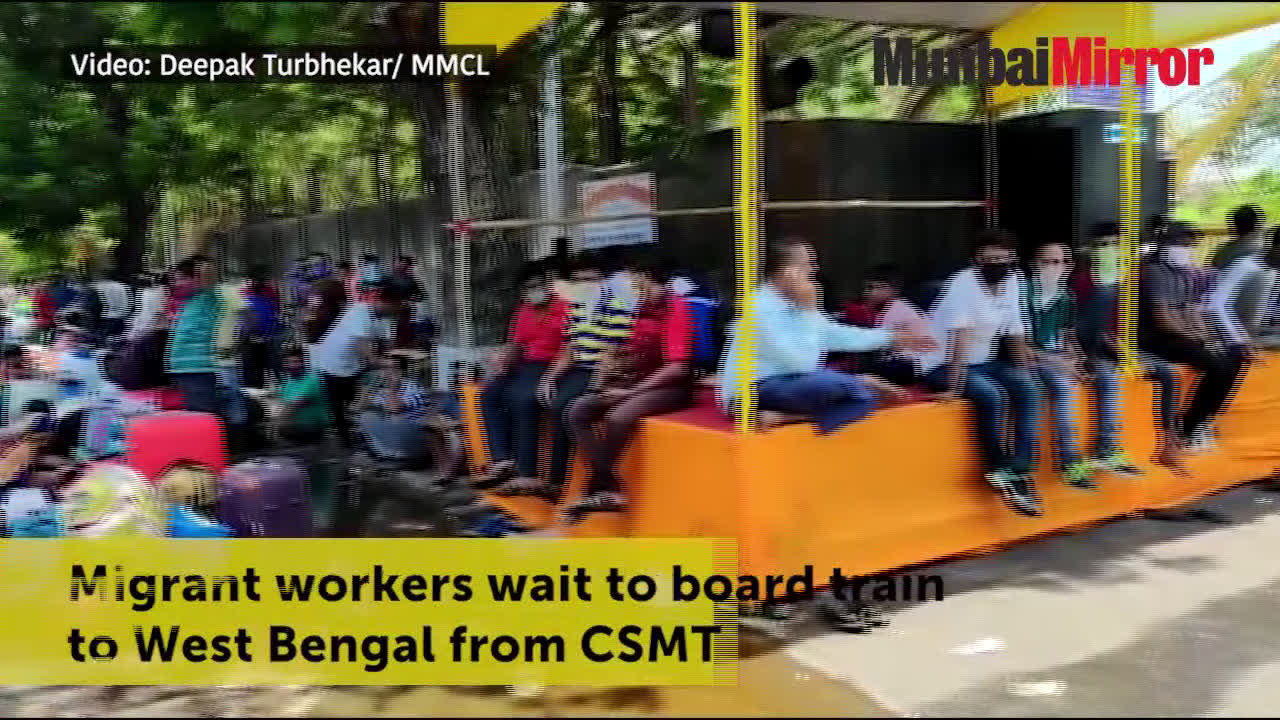 Migrant workers wait to board train to West Bengal from CSMT