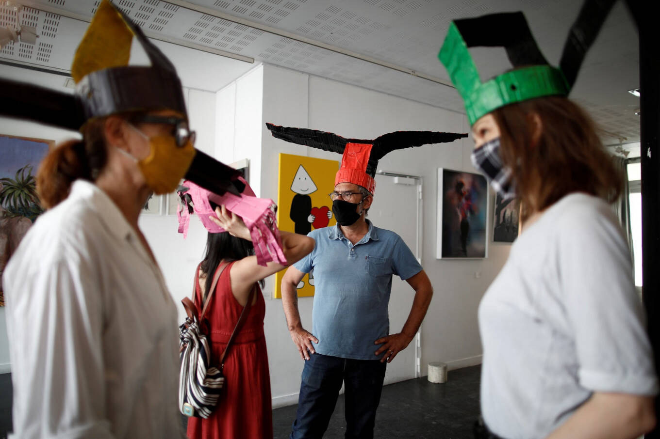 Special hats in this Paris art gallery will help maintain social distancing Special hats in this Paris art gallery will help maintain social distancing