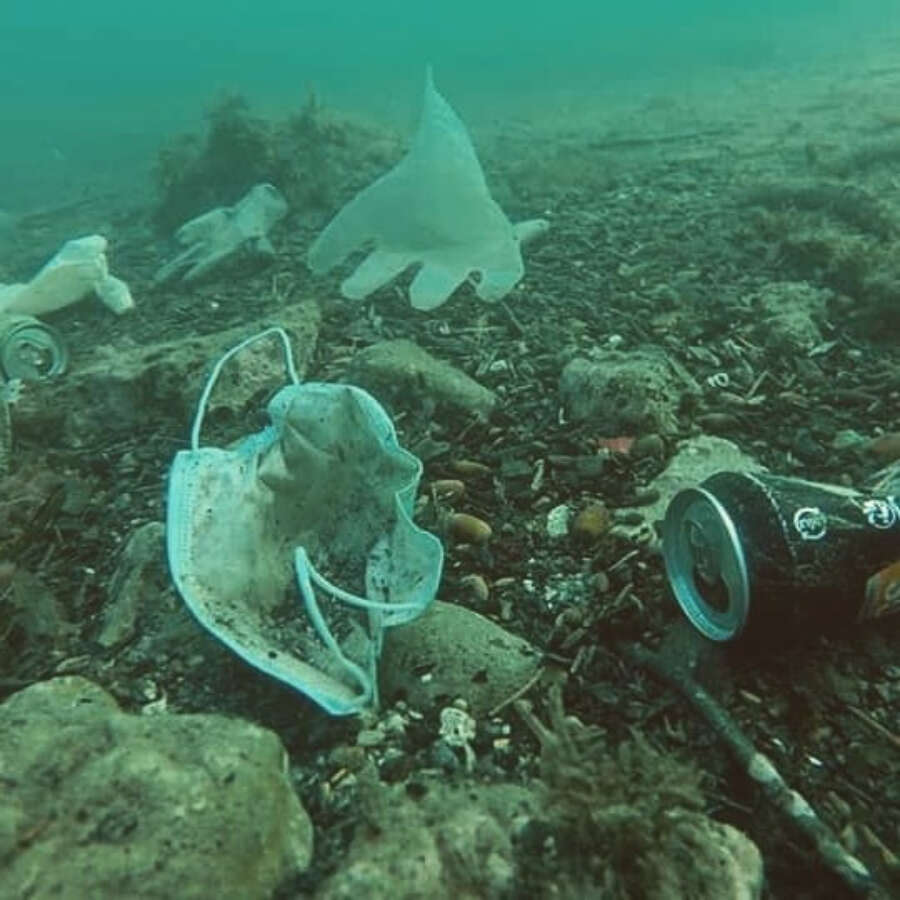 Masks and gloves wash up on the shores of the ocean