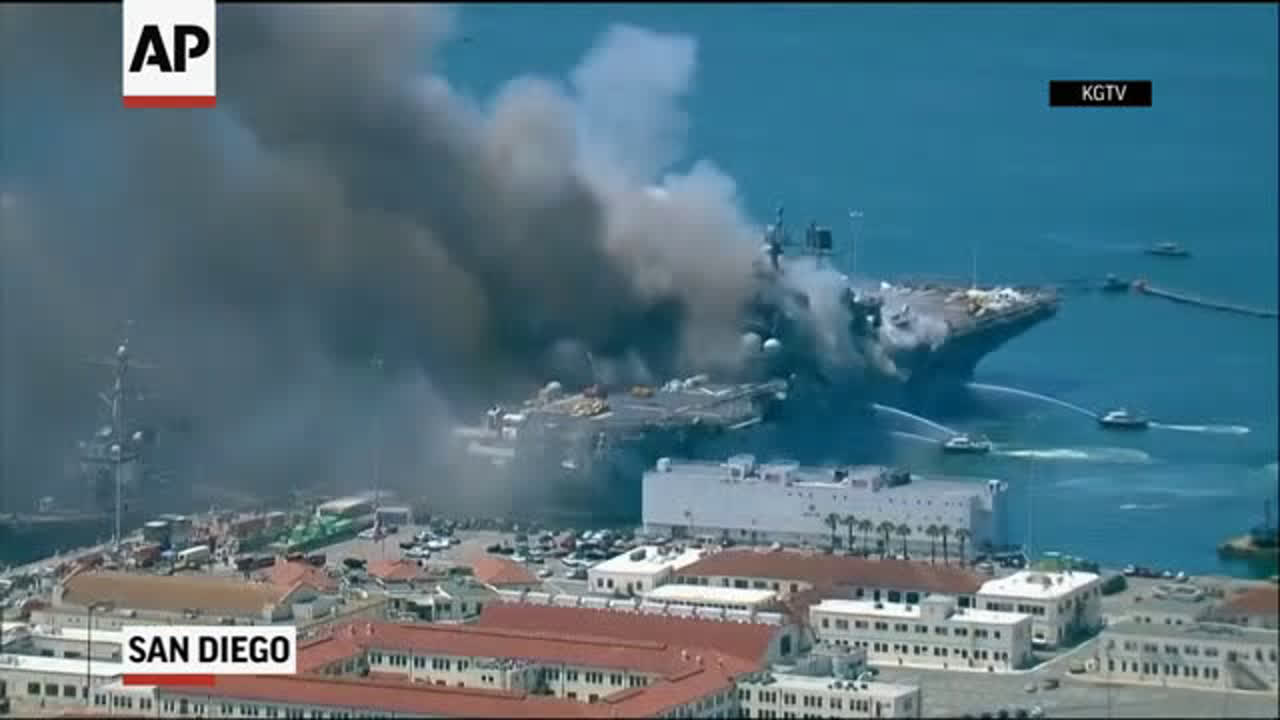 Aerials show ship ablaze at Naval Base San Diego