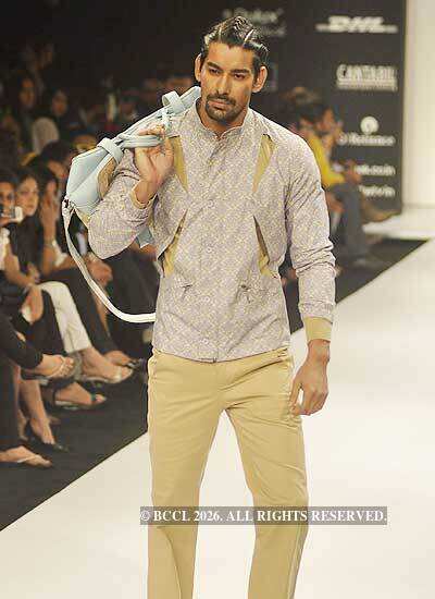 A model showcases a creation by designer Sanjay Hingu on Day 5 of the ...