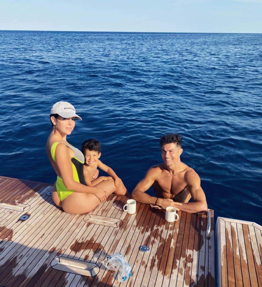 Cristiano Ronaldo and Georgina Rodriguez pose with Mateo Ronaldo for a  picture during their holiday - Photogallery