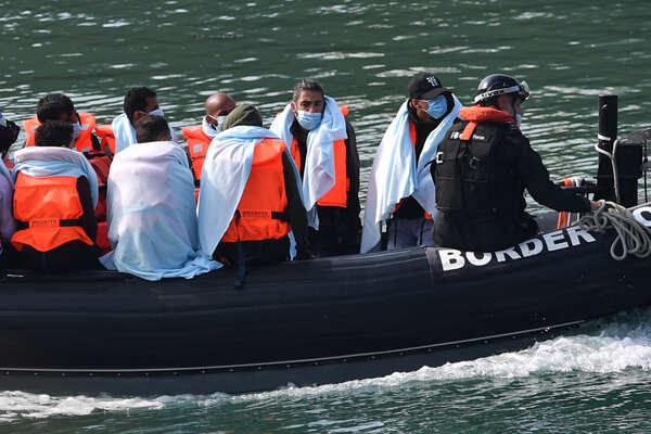 Migrants cross Channel in dinghies to England