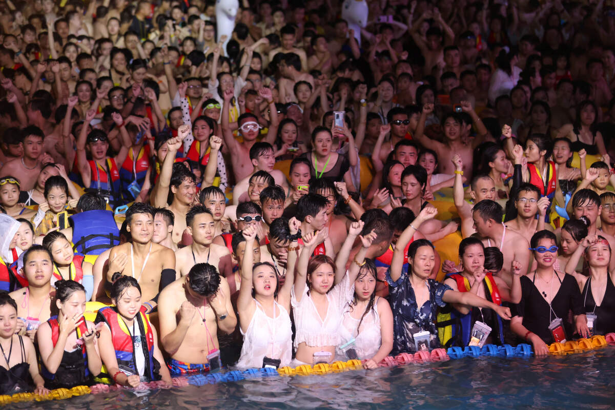 Amid Covid-19 outbreak around the world, thousands party together without masks in China's ground zero