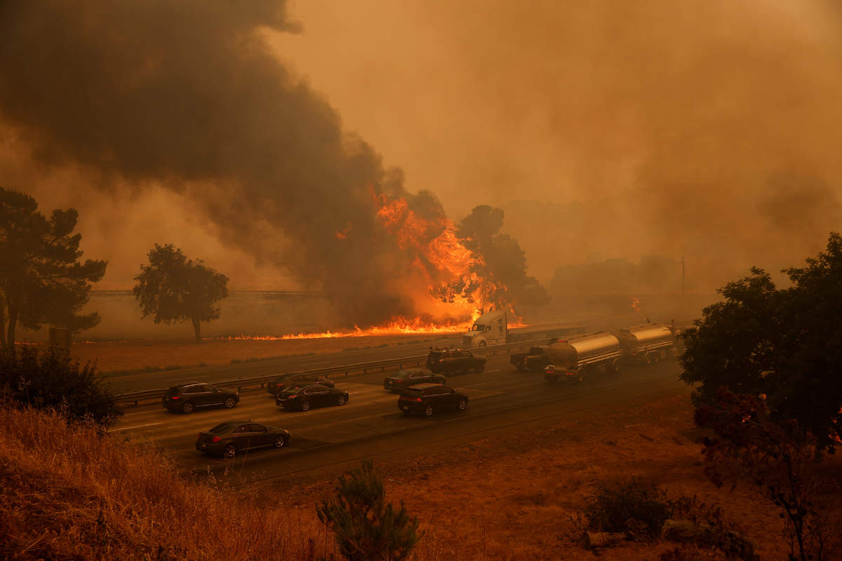 Wildfire grows in California, tens of thousands flee homes