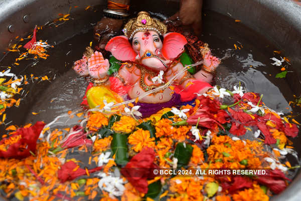 Devotees immerse idols of Lord Ganesha