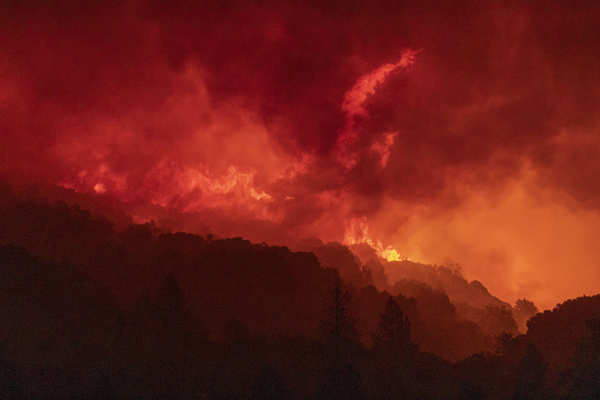 Wildfires turn California skies glowing orange