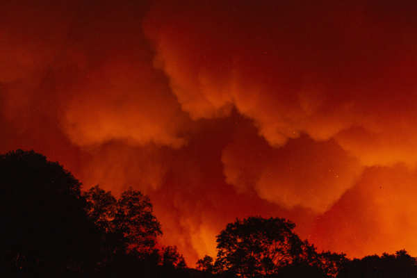 Wildfires turn California skies glowing orange