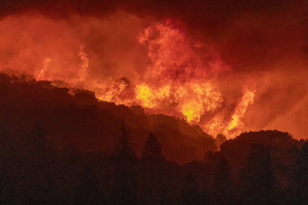 Wildfires turn California skies glowing orange