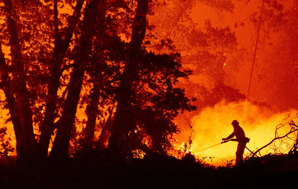 Wildfires turn California skies glowing orange