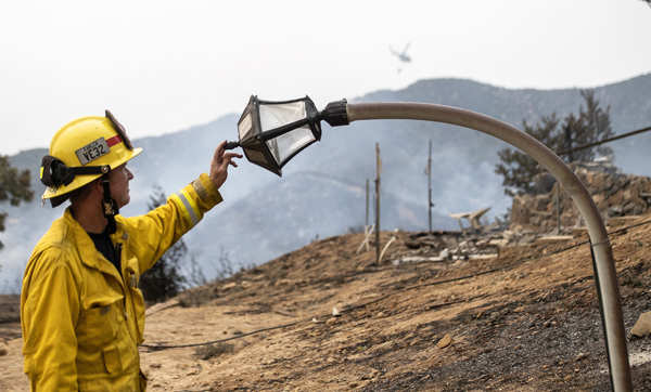 Wildfires turn California skies glowing orange