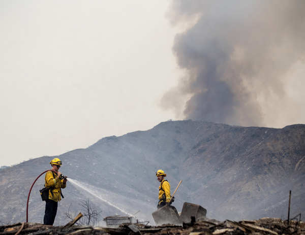 Wildfires turn California skies glowing orange