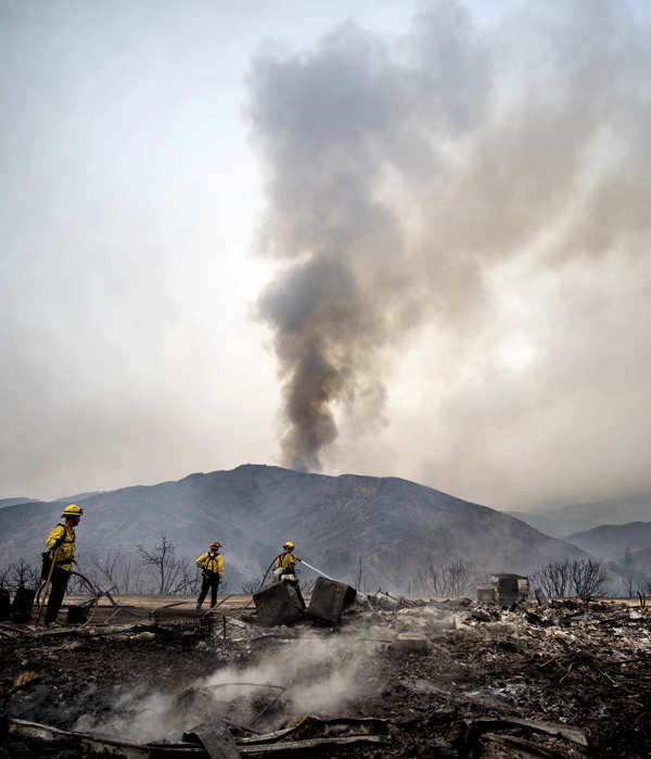 Wildfires turn California skies glowing orange