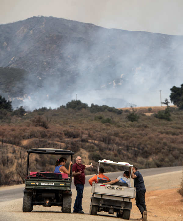 Wildfires turn California skies glowing orange