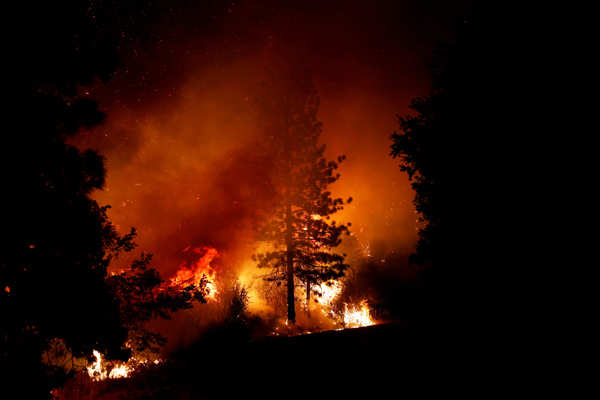 Wildfires turn California skies glowing orange