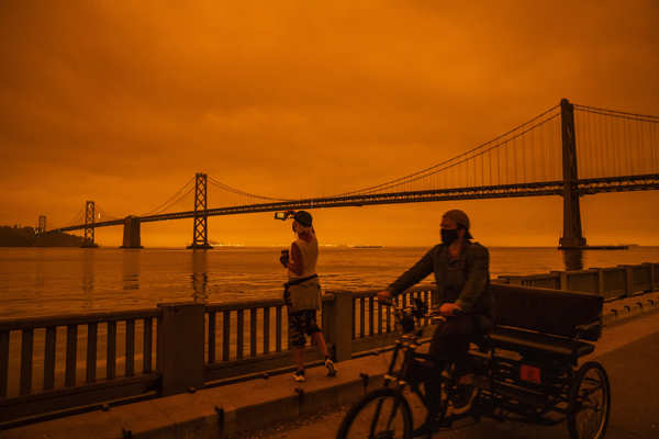 Wildfires turn California skies glowing orange