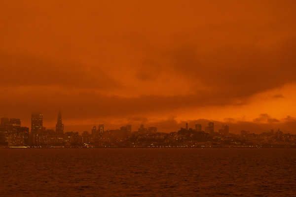 Wildfires turn California skies glowing orange